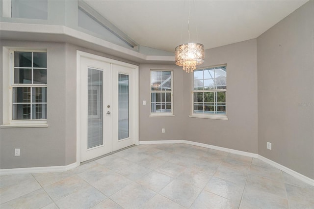 unfurnished dining area featuring light tile patterned floors, vaulted ceiling, french doors, and a chandelier