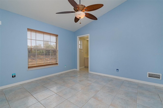 unfurnished room featuring vaulted ceiling, ceiling fan, and light tile patterned flooring