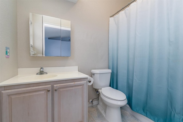 bathroom featuring vanity, toilet, curtained shower, and tile patterned flooring