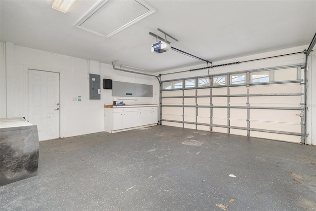 garage featuring a garage door opener and electric panel