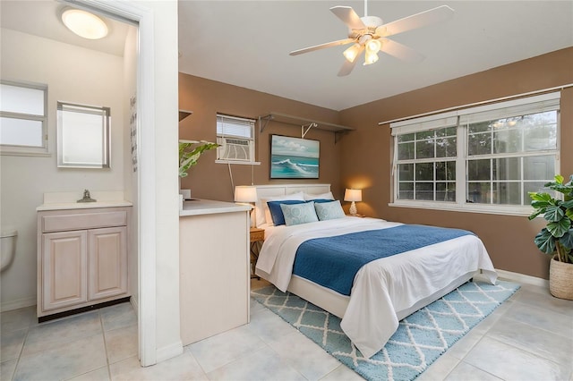 5366 Hader Rd, North Port, FL 34288 - bedroom featuring baseboards, ceiling fan, cooling unit, a sink, and light tile patterned floors