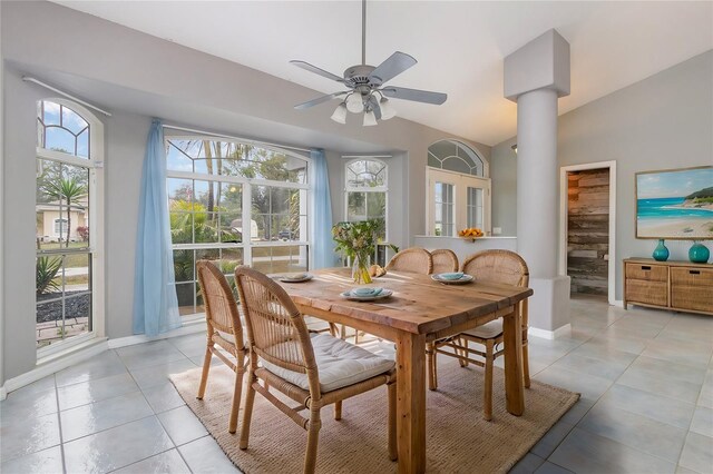 5366 Hader Rd, North Port, FL 34288 - dining area with decorative columns, baseboards, ceiling fan, light tile patterned floors, and vaulted ceiling