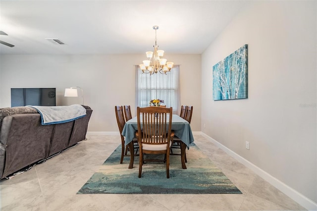 dining space with ceiling fan with notable chandelier