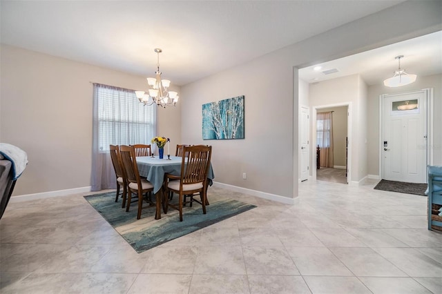 dining room with a chandelier