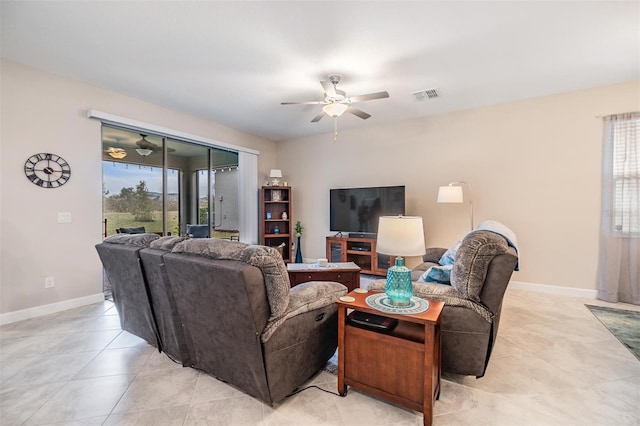 living room with ceiling fan and light tile patterned floors