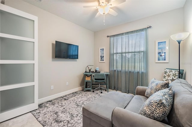 tiled living room with ceiling fan