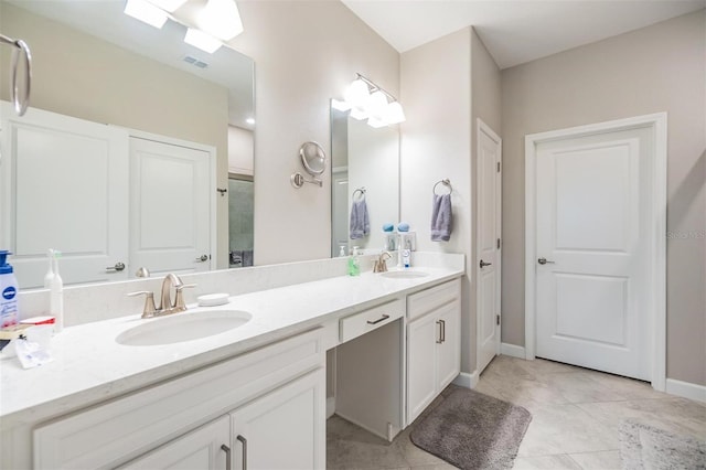 bathroom featuring tile patterned floors and vanity