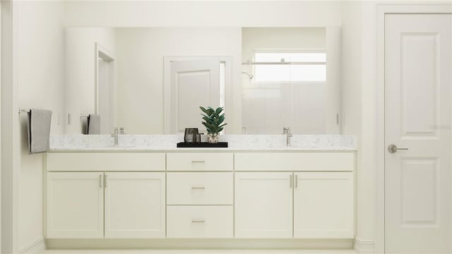 bathroom featuring vanity and a shower with shower door