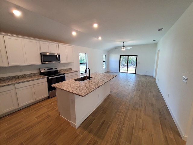 kitchen with white cabinetry, an island with sink, appliances with stainless steel finishes, and sink