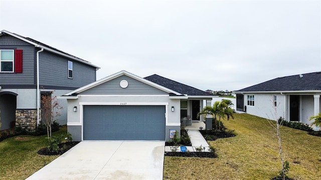 view of front of property featuring a garage and a front lawn