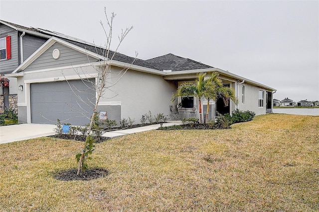 view of front of property with a garage and a front yard