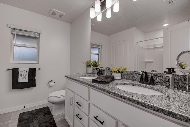 bathroom featuring vanity, walk in shower, toilet, tile patterned floors, and a textured ceiling