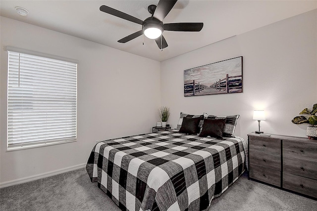 bedroom with ceiling fan and light carpet