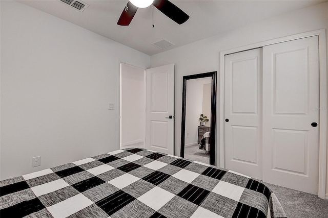 unfurnished bedroom with carpet, ceiling fan, and a closet