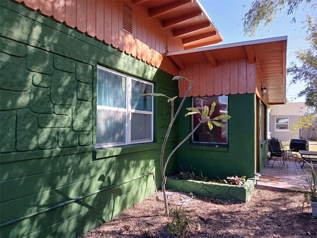 view of side of home featuring a patio