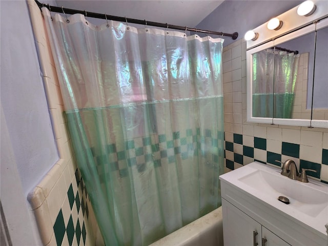 bathroom with vanity, shower / bathtub combination with curtain, tile walls, and backsplash