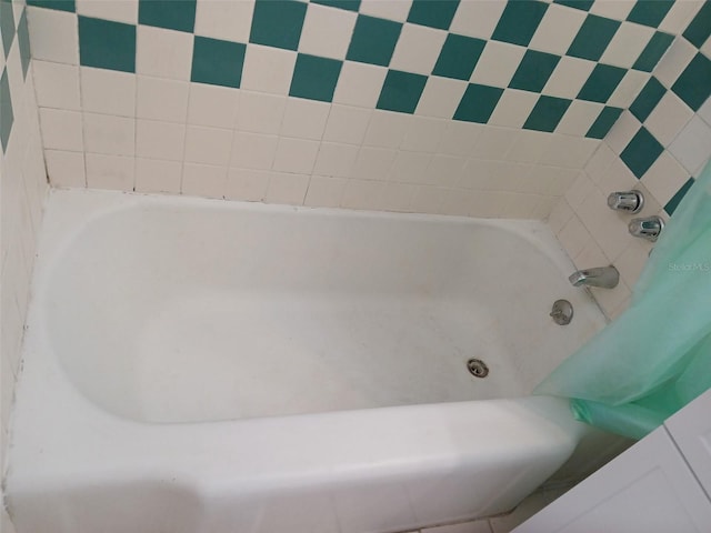 bathroom featuring a tub to relax in