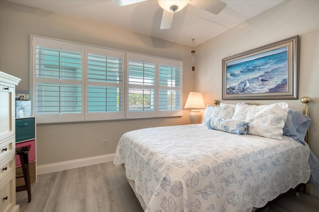 bedroom featuring ceiling fan and light hardwood / wood-style flooring