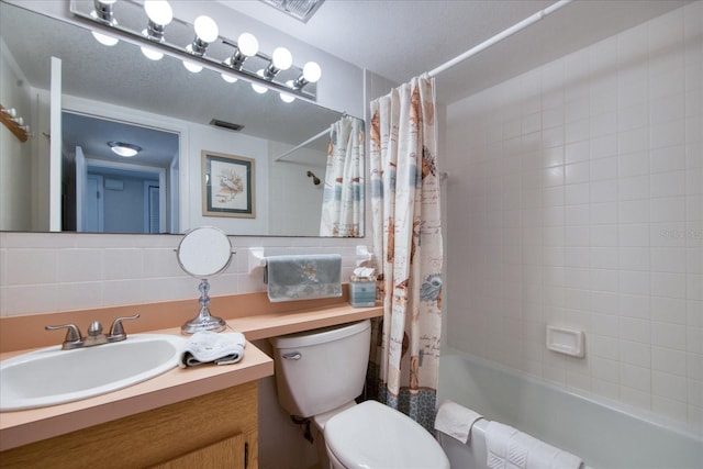 full bathroom with vanity, toilet, shower / bath combo with shower curtain, and backsplash