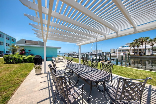 view of patio / terrace with a pergola and a water view