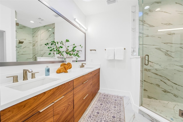 bathroom featuring vanity and an enclosed shower