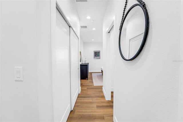 hall featuring light hardwood / wood-style flooring