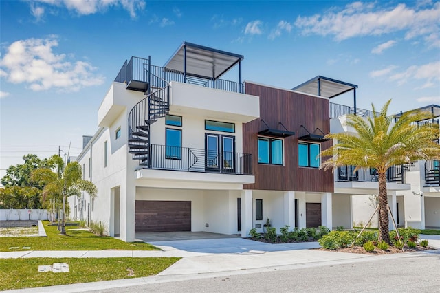 460 87th Ave N, Saint Petersburg, FL 33702 - view of front facade featuring stairs, stucco siding, an attached garage, and concrete driveway