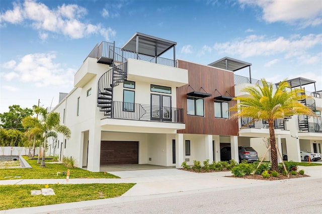 460 87th Ave N, Saint Petersburg, FL 33702 - view of front of house featuring stucco siding, an attached garage, and concrete driveway