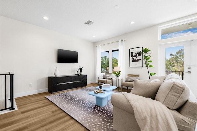 460 87th Ave N, Saint Petersburg, FL 33702 - living room with light wood-style flooring, recessed lighting, baseboards, and visible vents