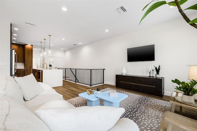 460 87th Ave N, Saint Petersburg, FL 33702 - living room with wood finished floors, recessed lighting, baseboards, and visible vents