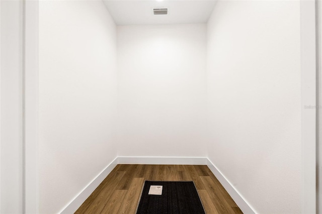 460 87th Ave N, Saint Petersburg, FL 33702 - interior space featuring baseboards, dark wood-style flooring, and visible vents