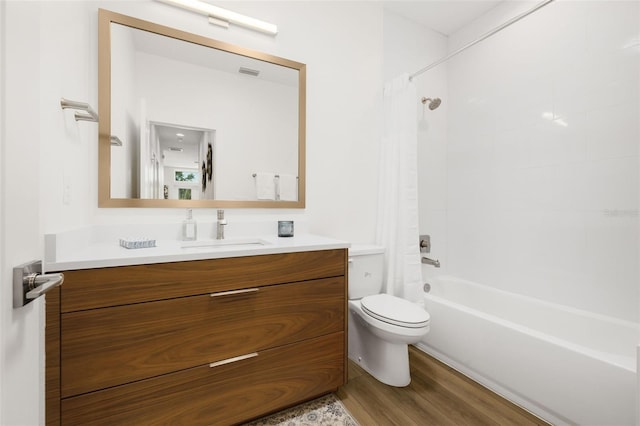 460 87th Ave N, Saint Petersburg, FL 33702 - full bathroom with visible vents, toilet, wood finished floors, vanity, and shower / bath combination with curtain