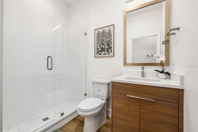 460 87th Ave N, Saint Petersburg, FL 33702 - full bath with a stall shower, toilet, wood finished floors, and vanity