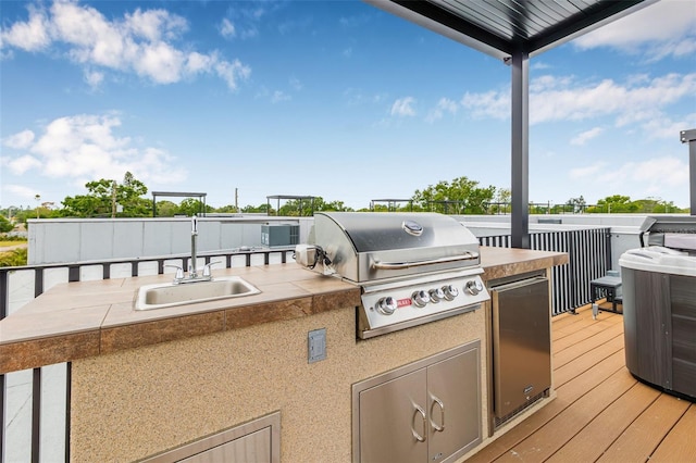 460 87th Ave N, Saint Petersburg, FL 33702 - wooden deck featuring a sink, area for grilling, and a grill