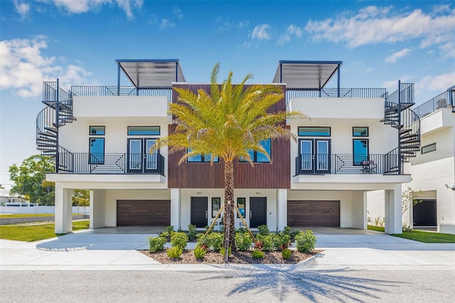 460 87th Ave N, Saint Petersburg, FL 33702 - view of front facade with driveway, a garage, and stucco siding