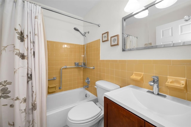 full bathroom featuring shower / bath combo, tile walls, vanity, and toilet