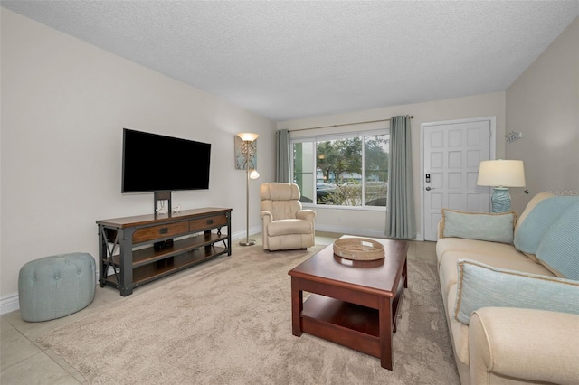 living room featuring tile patterned floors and a textured ceiling