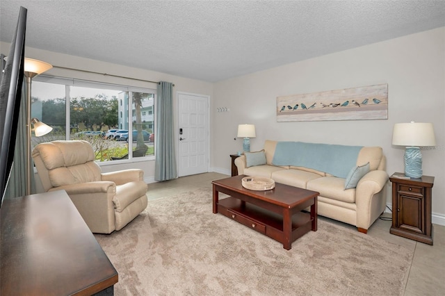 tiled living room with a textured ceiling