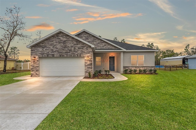 craftsman house with a garage and a lawn