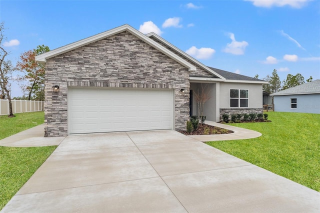 view of front of home with a garage and a front lawn