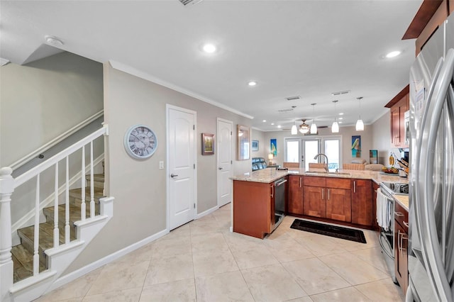 kitchen featuring pendant lighting, sink, appliances with stainless steel finishes, light stone countertops, and kitchen peninsula