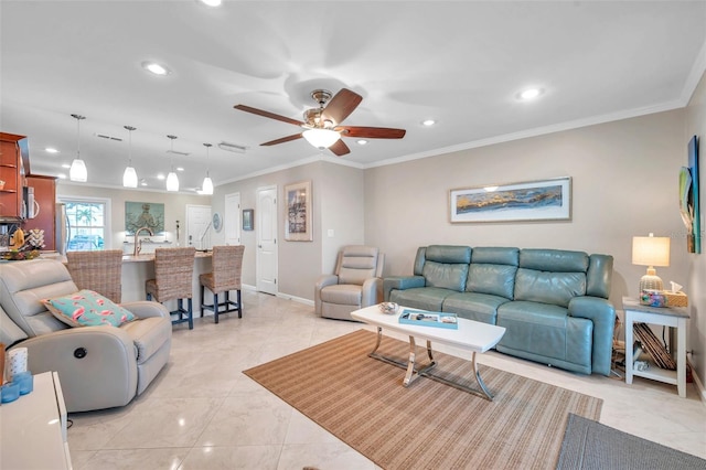 living room with crown molding, ceiling fan, and sink