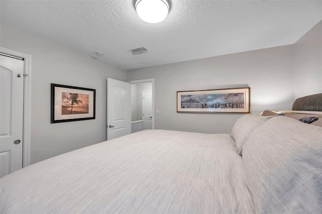 bedroom with a textured ceiling