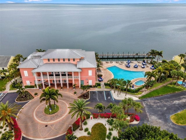 birds eye view of property with a water view