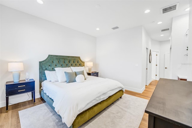 bedroom with light hardwood / wood-style floors