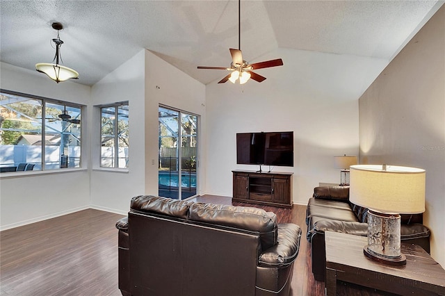 living room featuring lofted ceiling, dark hardwood / wood-style flooring, and ceiling fan