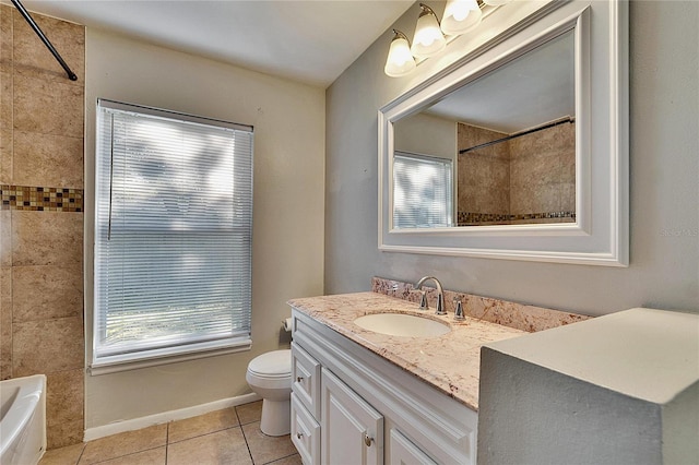 bathroom featuring vanity, tile patterned floors, and toilet