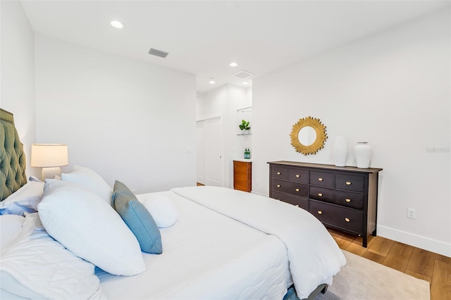 bedroom with light hardwood / wood-style flooring