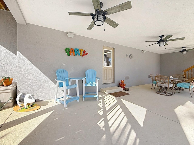 view of patio featuring ceiling fan