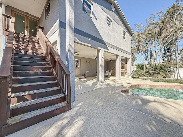 exterior space with a fenced in pool and a patio